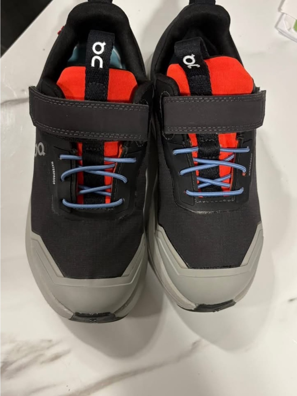 On Running Kids Black and Red Sneakers with Blue Laces